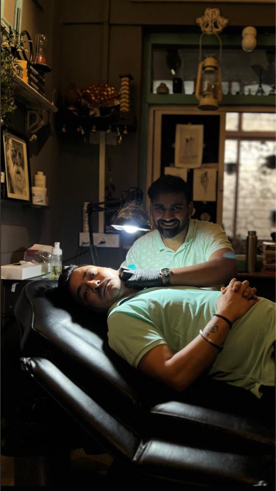 Tattoo artist at the Screamzonetattoo studio in Ghatkopar, Mumbai
