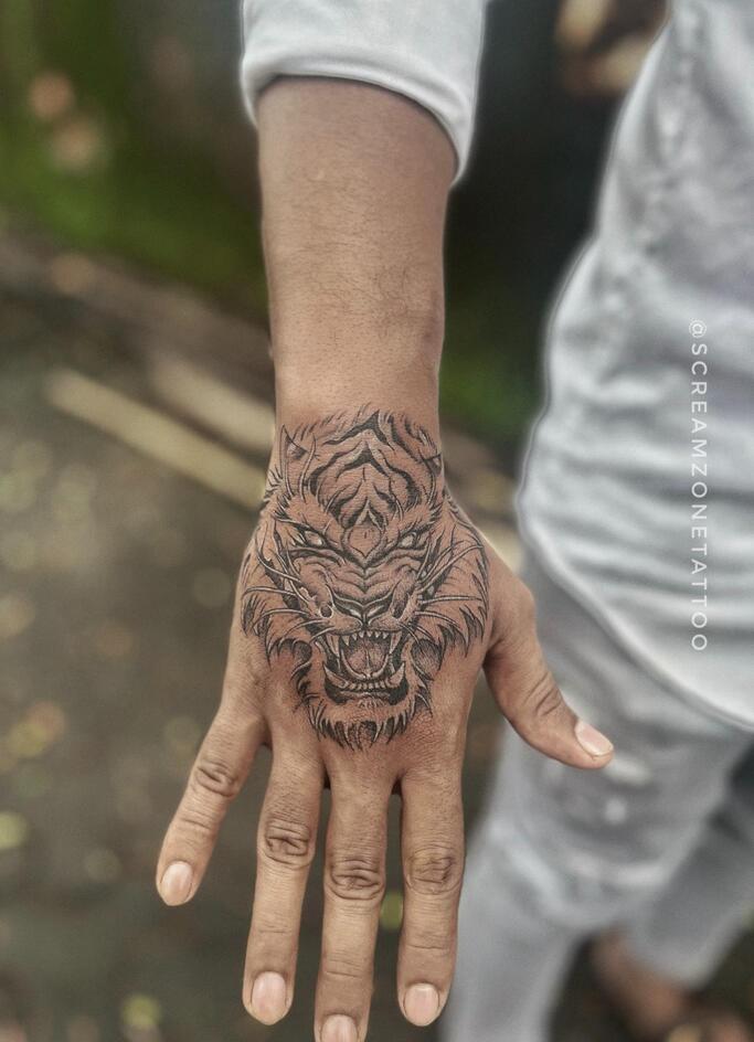 Tiger On Palm tattoo, Screamzonetattoo tattoo studio in Mumbai