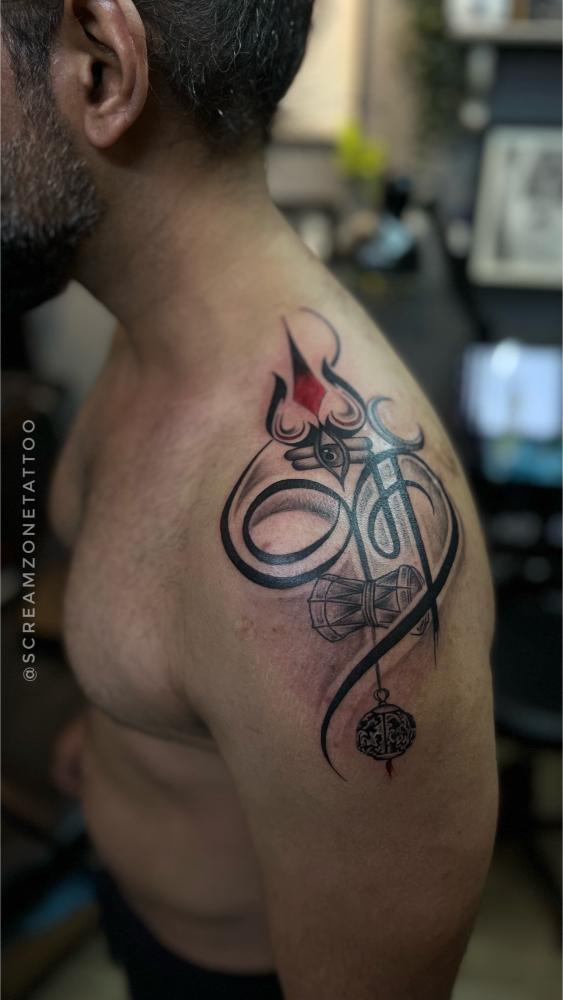 Spiritual Trishul tattoo by tattoo artist in Ghatkopar, Screamzonetattoo