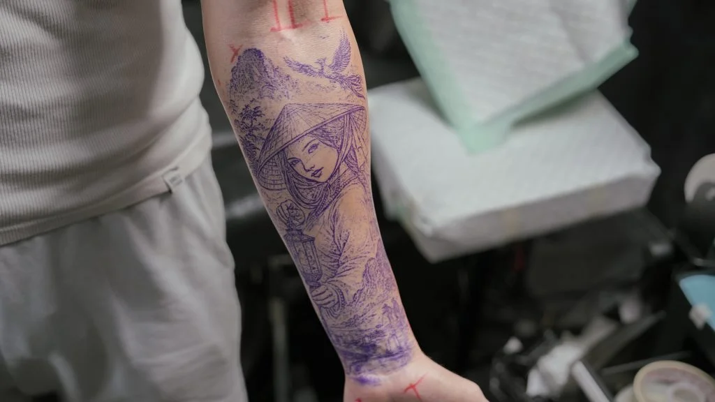 Purple tattoo stencil outline transferred onto skin